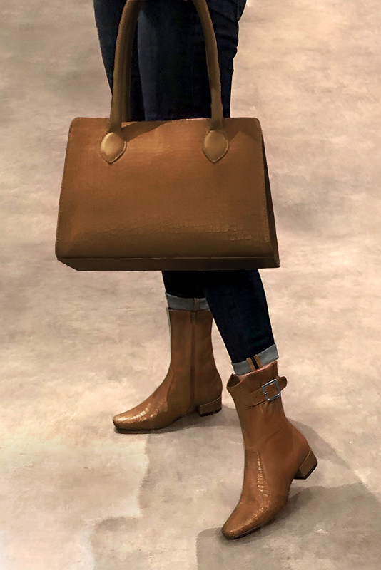 Caramel brown women's ankle boots with buckles on the sides. Round toe. Low block heels. Worn view - Florence KOOIJMAN